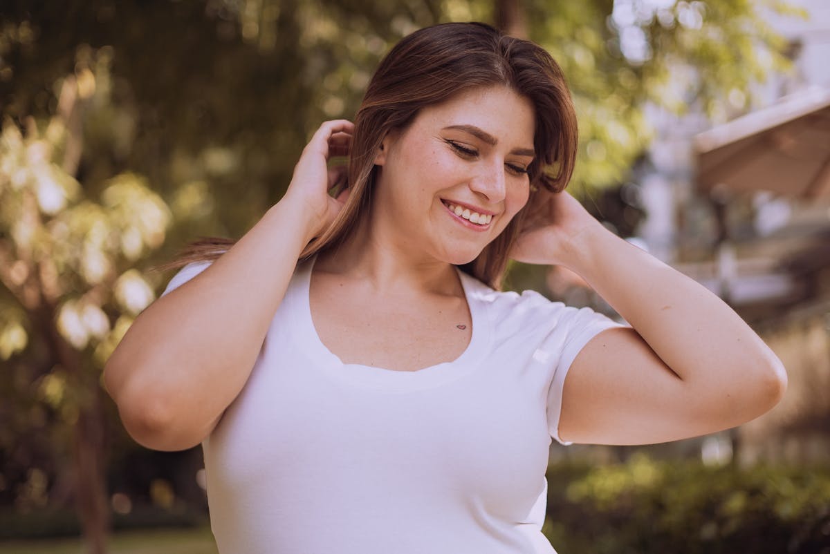 Happy woman smiling outdoors — real users on a GLP-1 nutrition plan